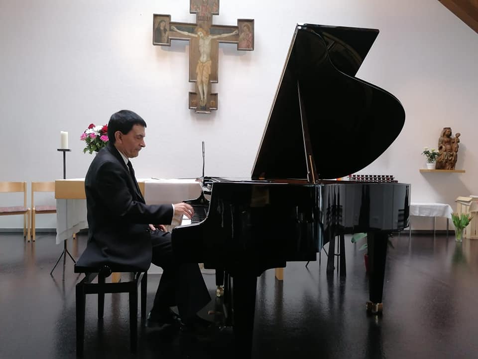 An Image of Raul Playing in a church